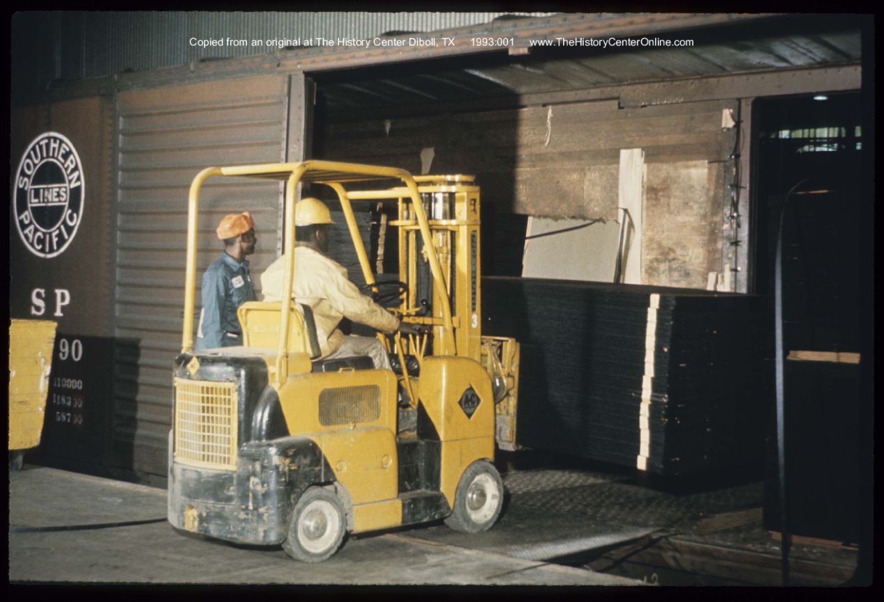 1970, Loading fiberboard on rail car, ca.
