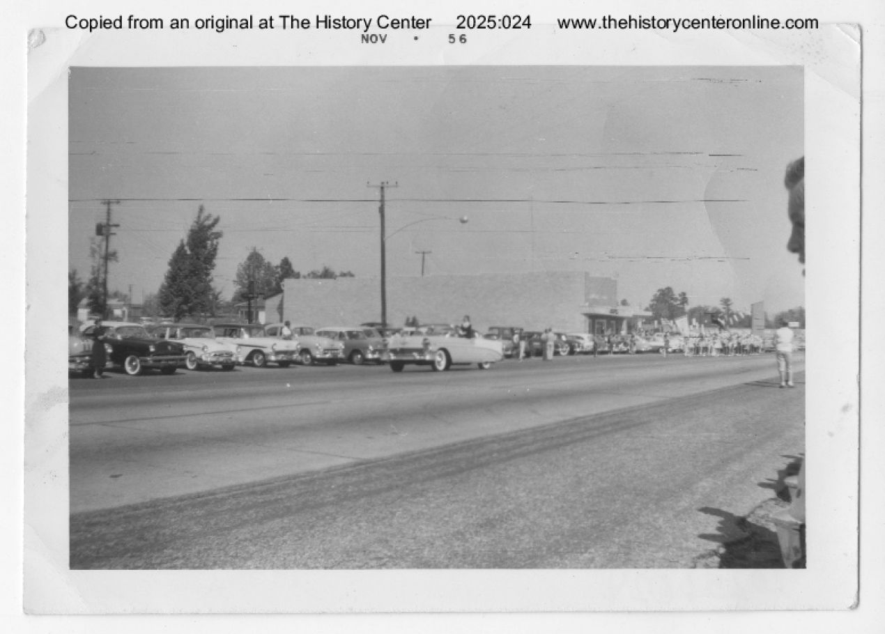 1956, Diboll Day Parade with car driving down street, Diboll, Texas, November