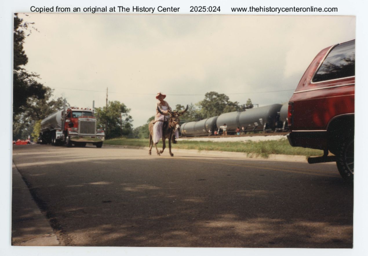 1986, 1988, Person riding donkey dressed as longhorn at Diboll Day Parade, by Kodak, Diboll, Texas, ca.