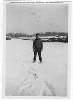 1945, Jughead standing in snow at Ordinance Depot in Paris, France